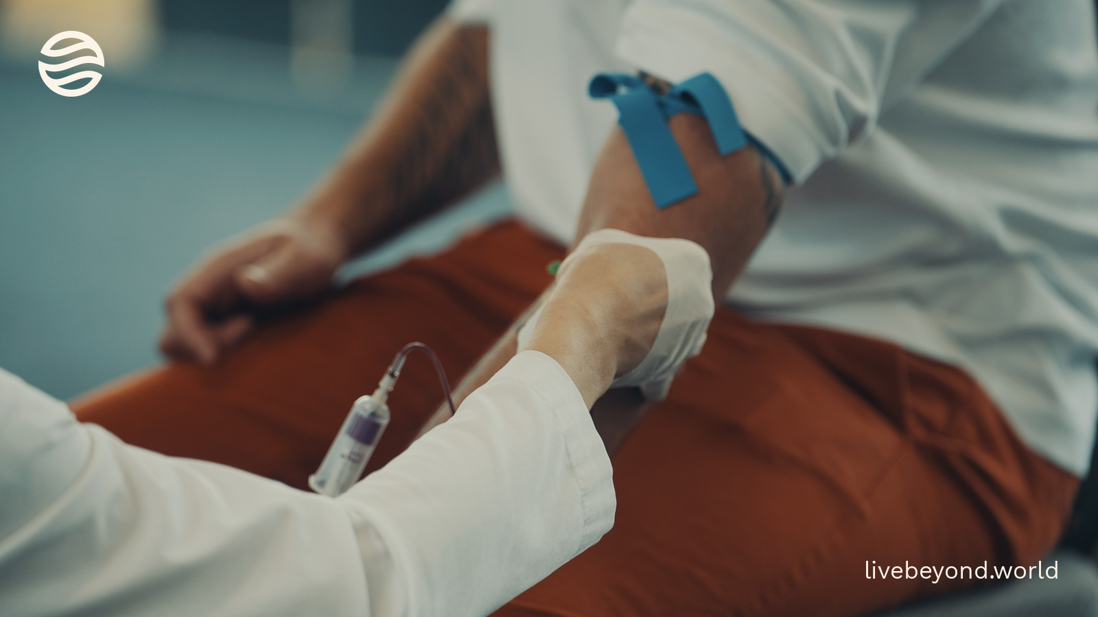 A close-up of a blood draw from Marek's arm.