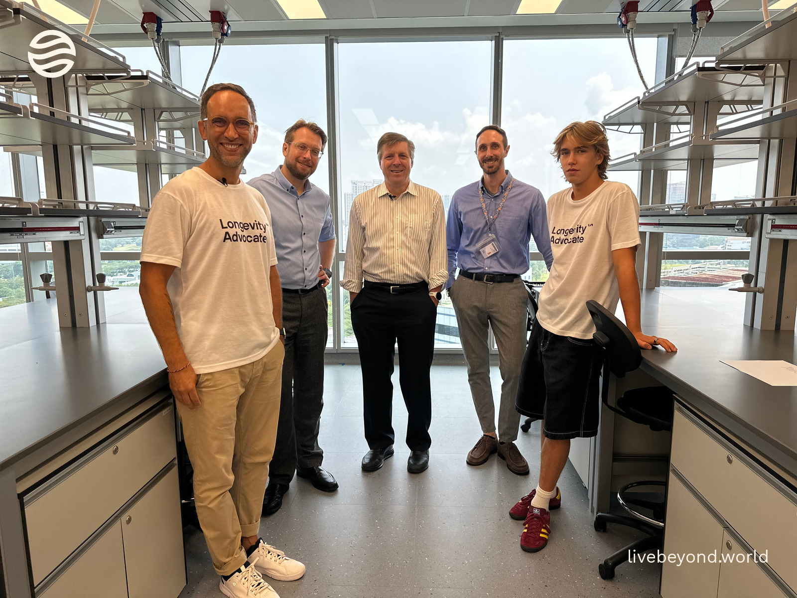 Marek, Jan Gruber, Brian Kennedy, Vincenzo Sorrentino and Alek standing together in a bright laboratory.