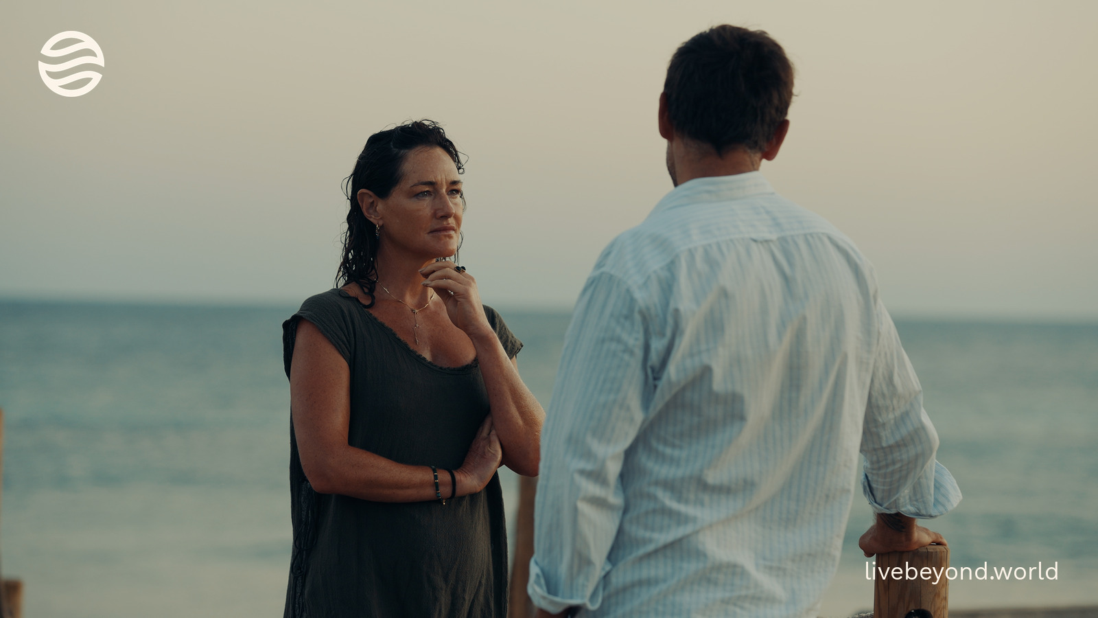 Dr Tamsin Lewis and Marek talking by the sea in Formentera.