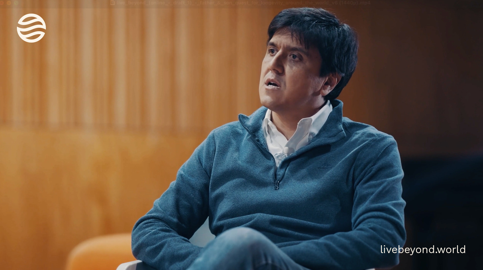 Felipe Salech talking during an interview in a warm wooden room.