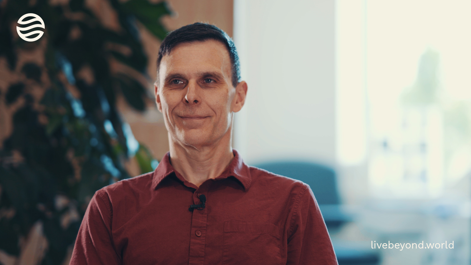 Matt Kaeberlein smiling in a red shirt.