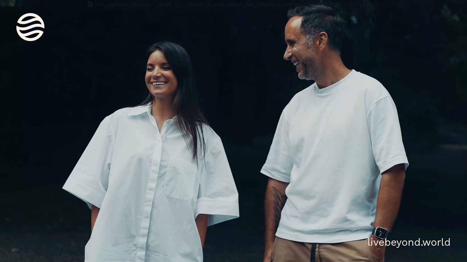 Nikolina Lauc and Marek, both in white, smiling at each other.