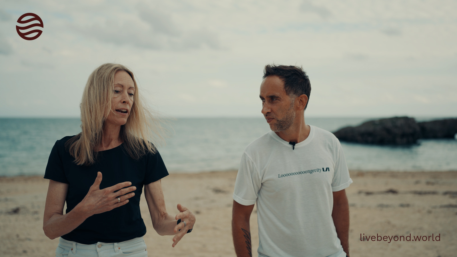 Tina Woods and Marek talking on a beach in Okinawa.
