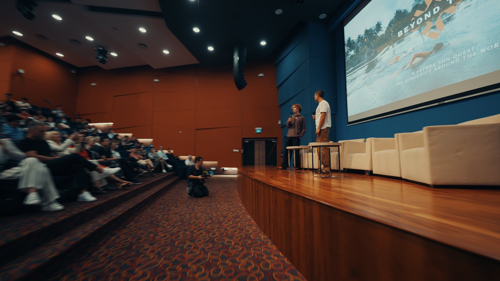 Marek and Aleksander on stage at the National University of Singapore