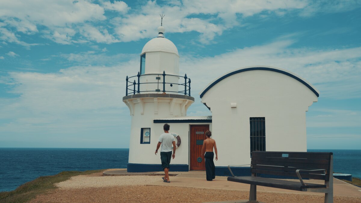 Marek and Alek walking to a lighthouse in Australia