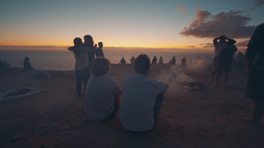 Marek and Alek at a sunrise ceremony by the ocean in Australia
