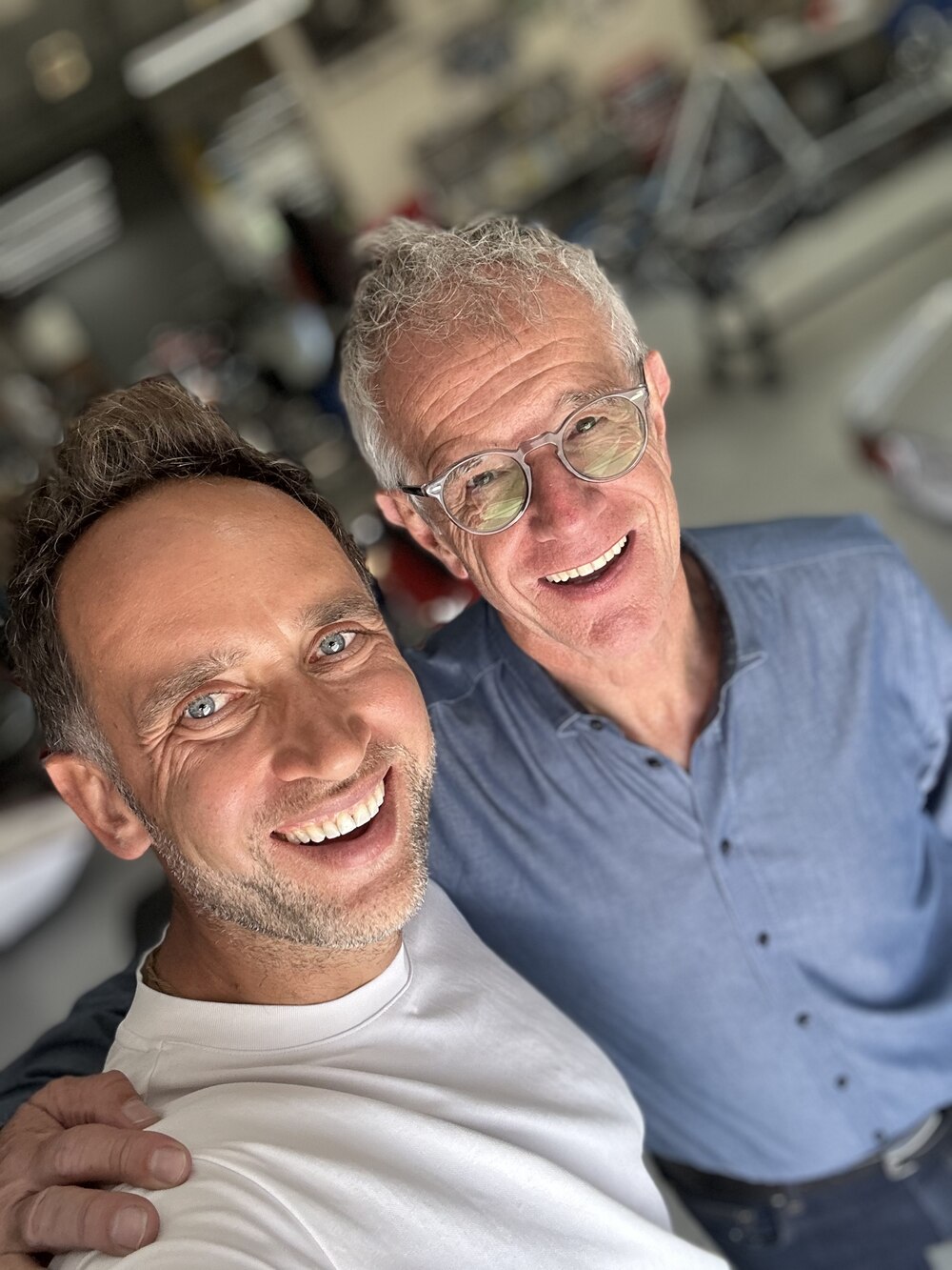 Marek and Eric Verdin smiling at the racetrack