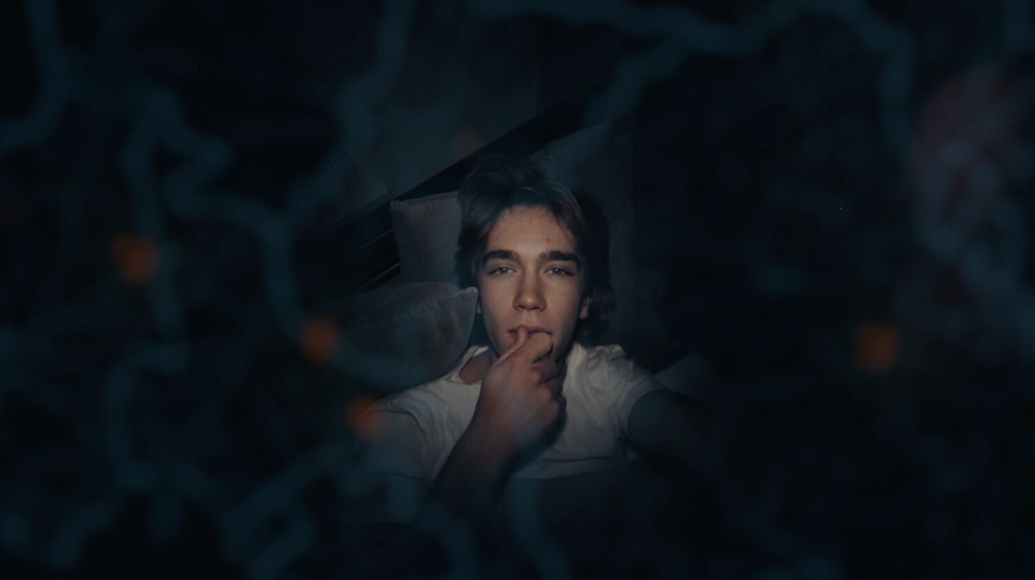 Alek watching the map at night