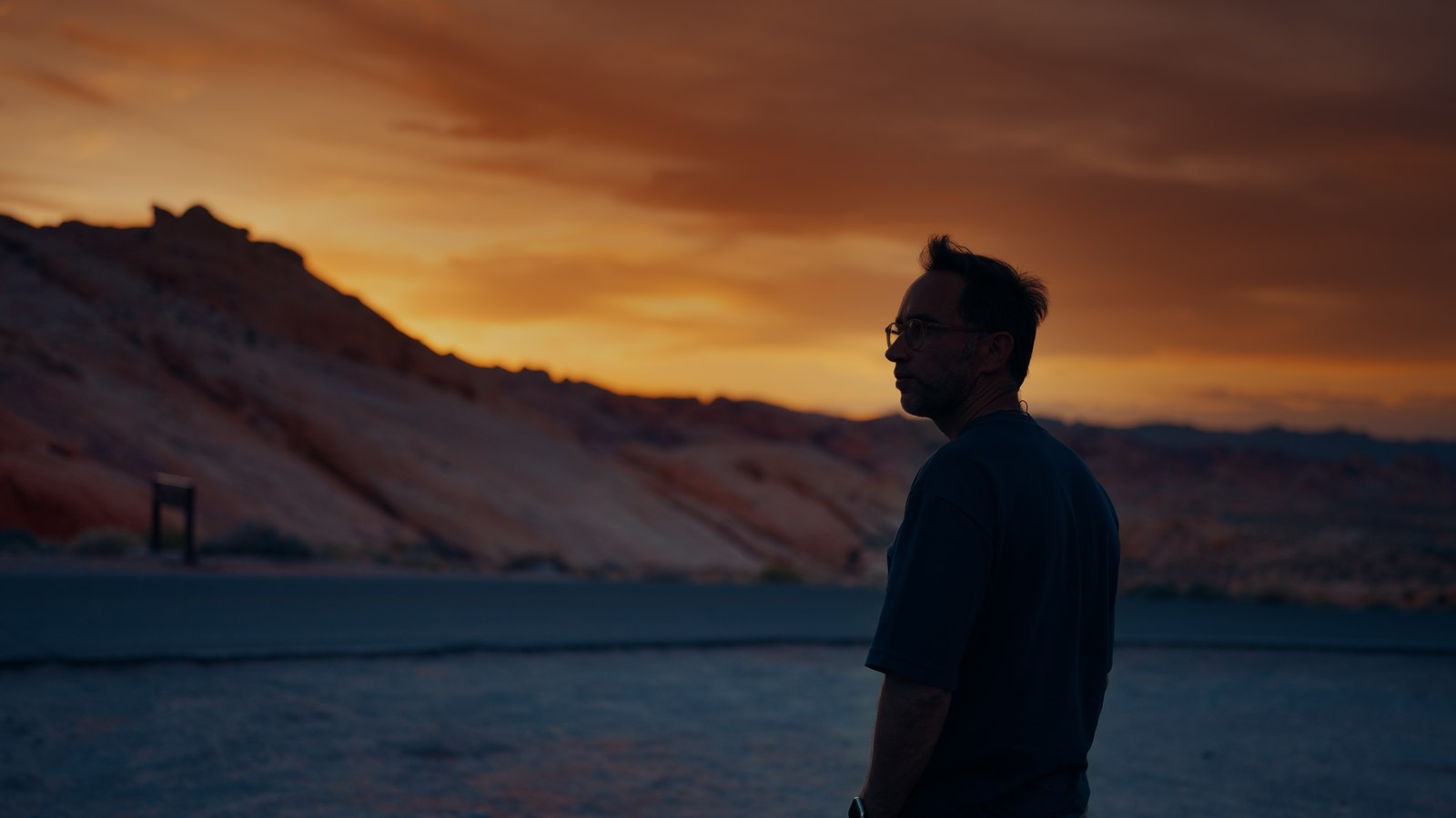 Marek at sunset between the red rocks and the road, Arizona