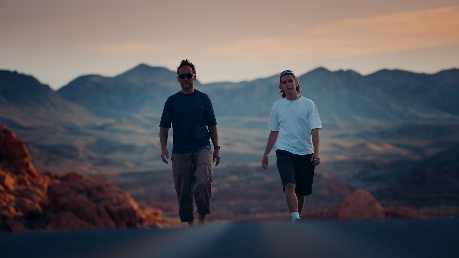 Marek and Alek walking the desert road in Arizona