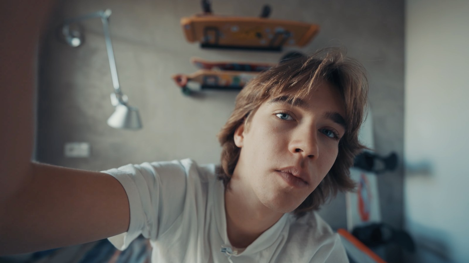 Aleksander Piotrowski, the narrator of the film, setting up the camera in his room