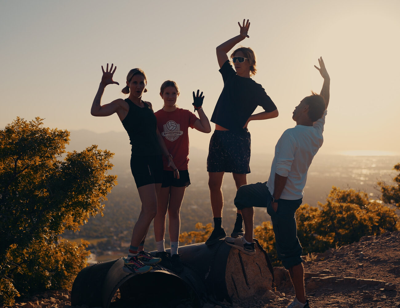 Amy Killen with her daughter and Marek with Aleksander, mountain-bike trip at sunset, Utah