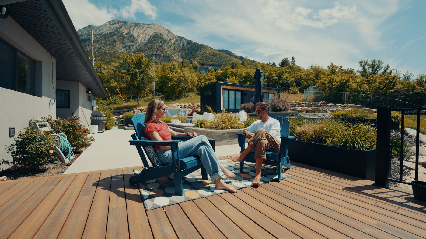 Amy Killen and Marek on the deck at her home in Salt Lake City, mountains behind