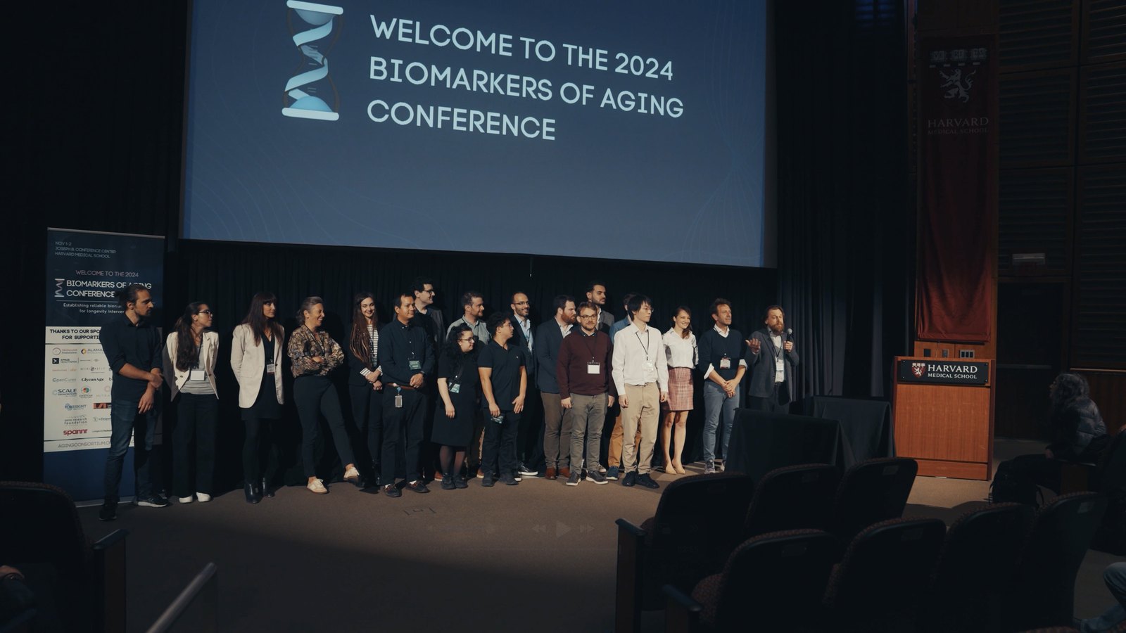 The organisers of the Biomarkers of Aging conference on stage at Harvard 2024, including Andrea Maier