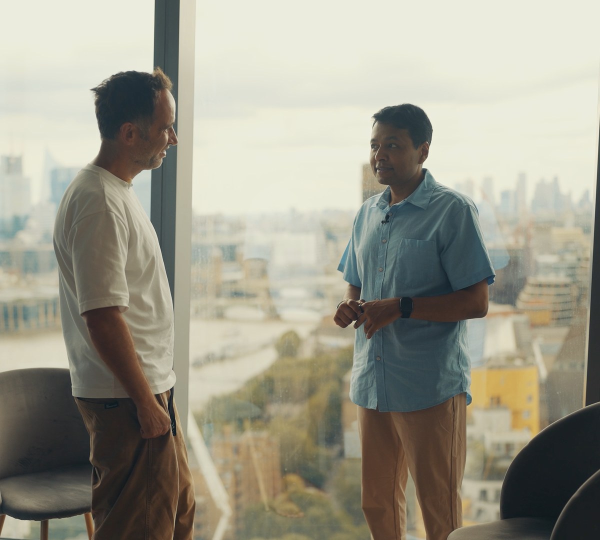 Avi Roy with Marek in a London apartment above the Thames