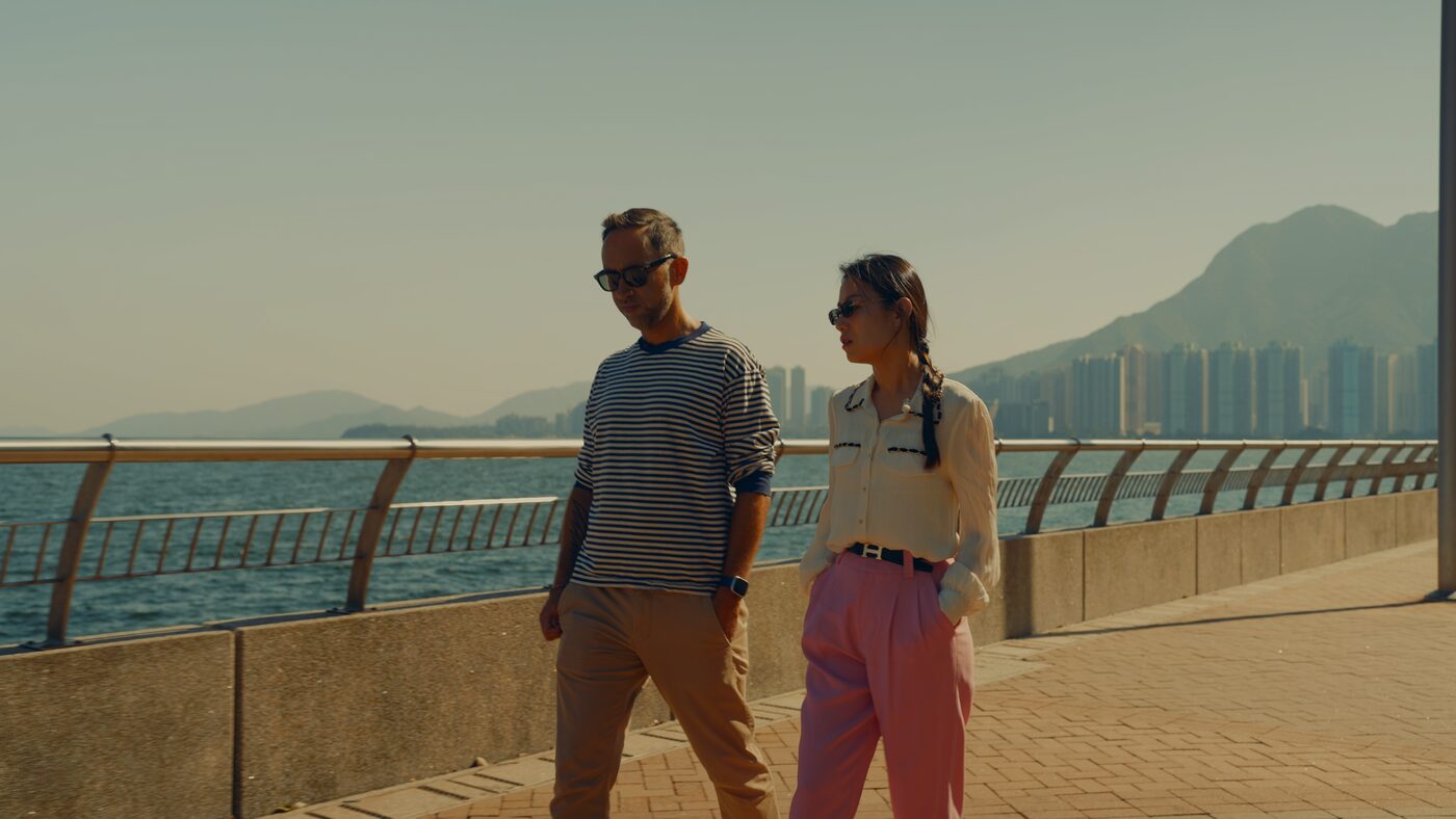 Christine Yuan Huang and Marek walking along the bay in Hong Kong
