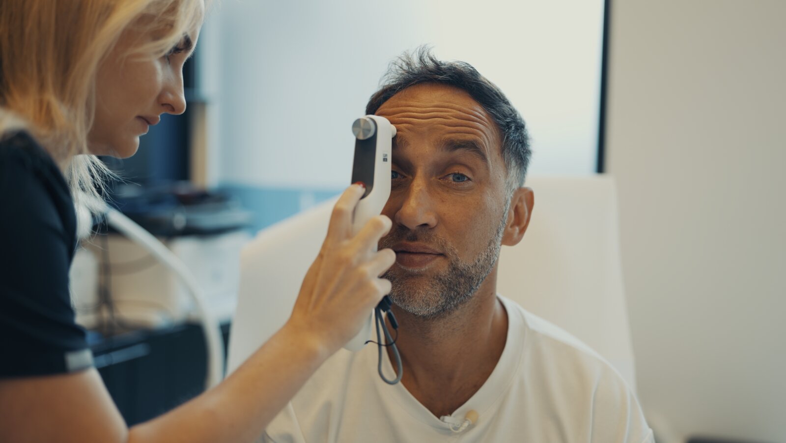 Marek having his eyes examined by a nurse at the Longevity Center in Warsaw