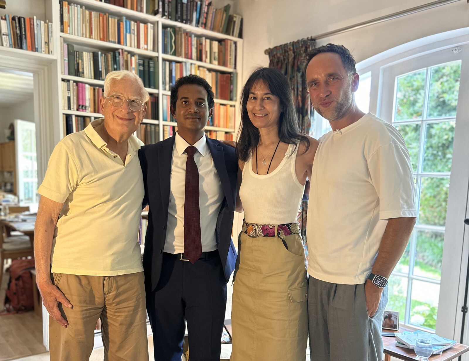 Christopher Ball, Sasi Senga, Leslie Kenny and Marek together in the book-lined library in Oxford after the interview