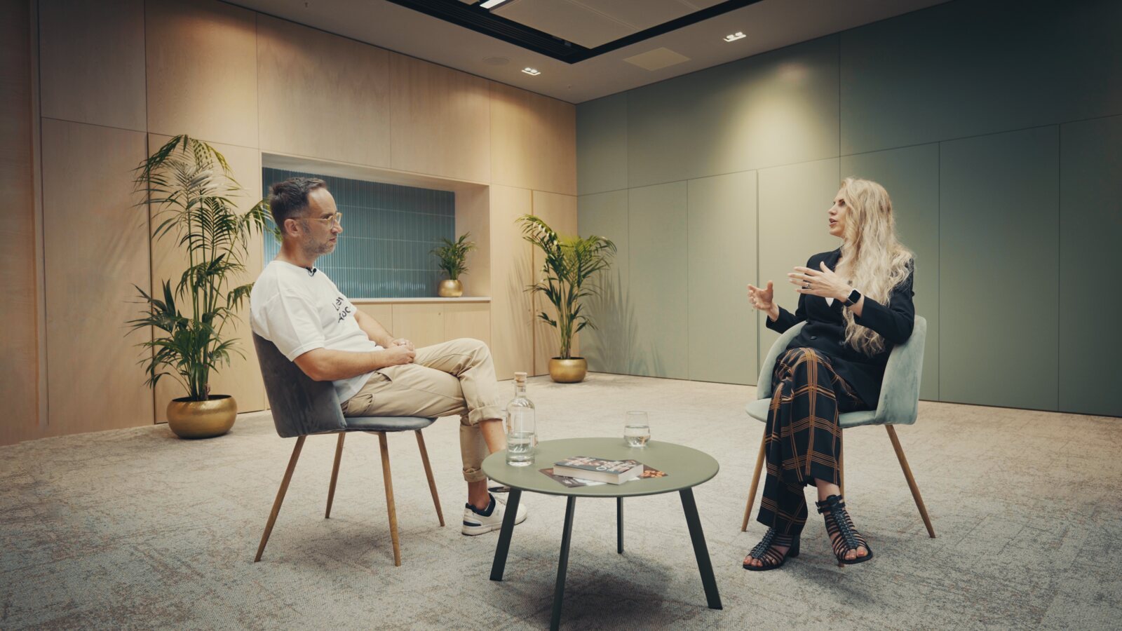 Marek Piotrowski interviewing Liz Parrish, the Live Beyond book on the table