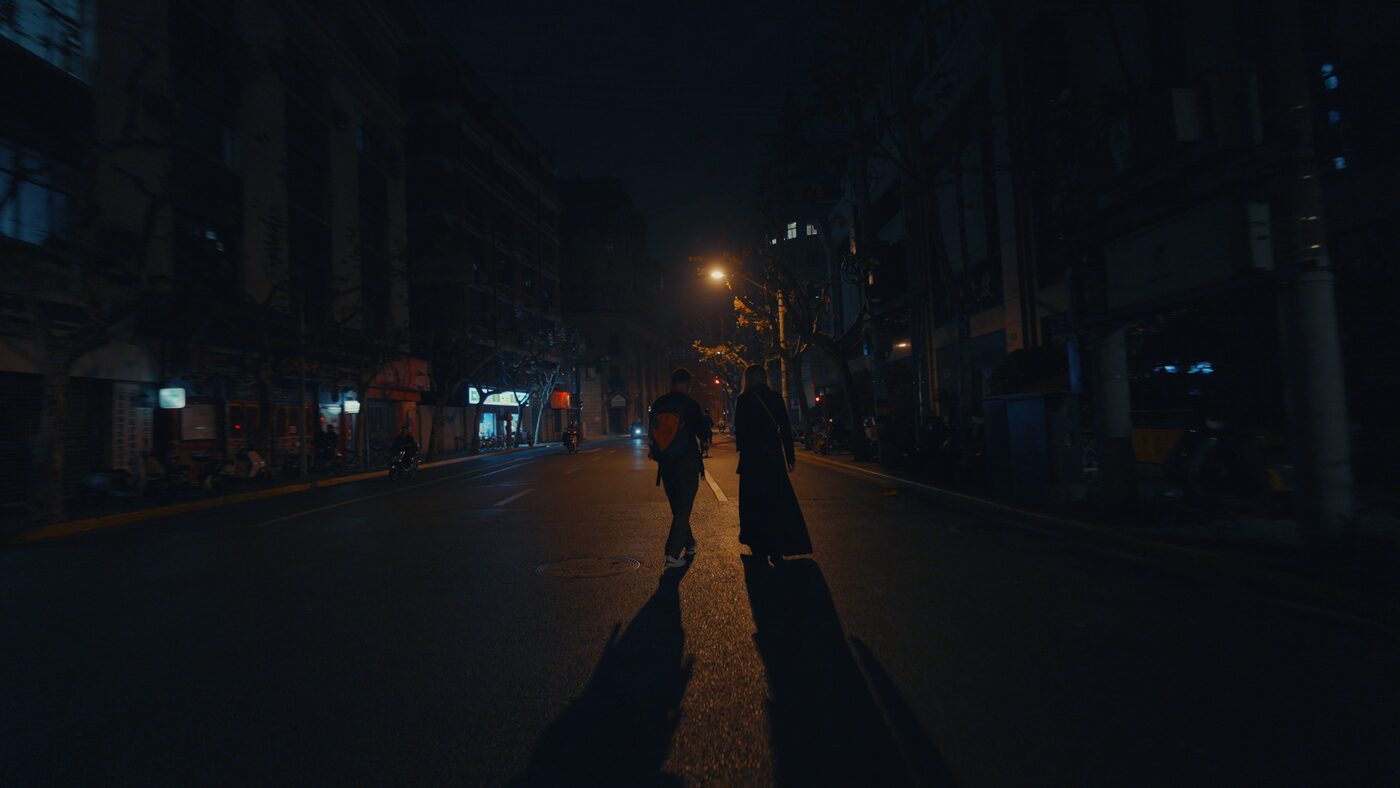 Liz Parrish and Aleksander walking through Shanghai at night