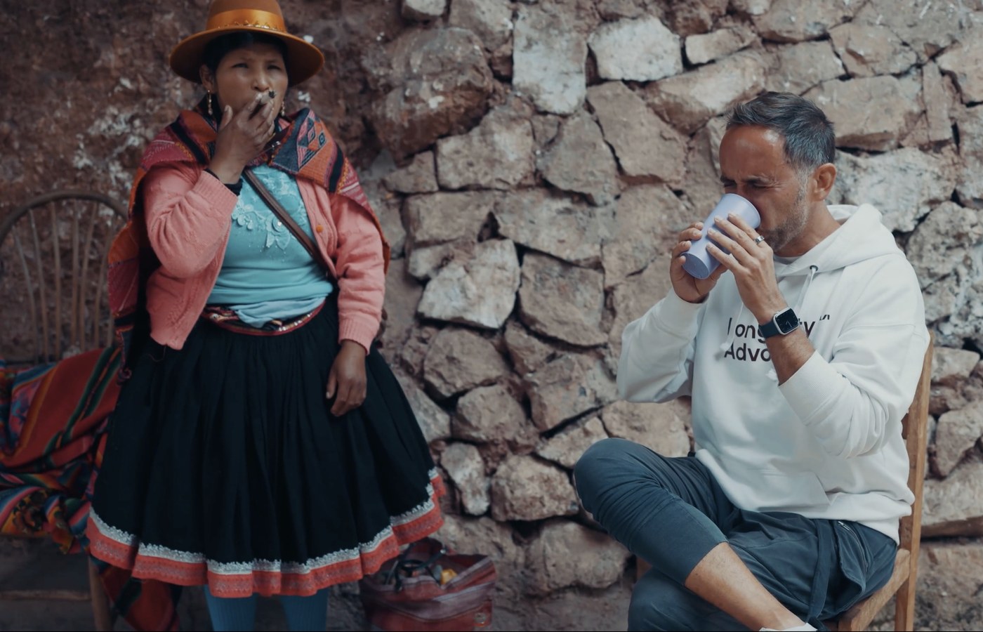Marek drinking the San Pedro during the ceremony while Maestra Lucia stands beside him