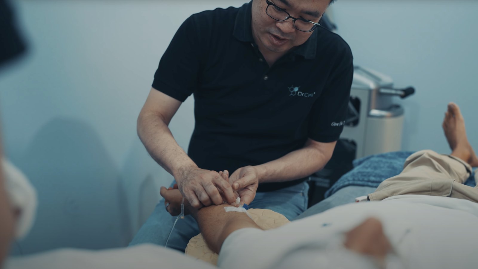 Michael Lim administering the stem cell treatment to Marek Piotrowski