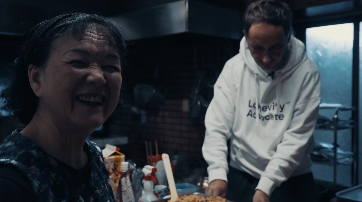 Emi-san laughing in her kitchen with Marek Piotrowski at Emi no Mise, Ogimi, Okinawa