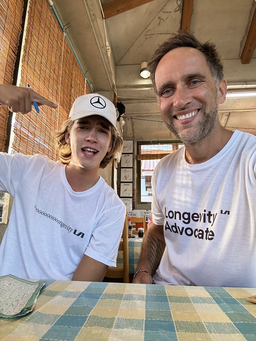 Marek and Aleksander Piotrowski at a table in an eating house on Okinawa