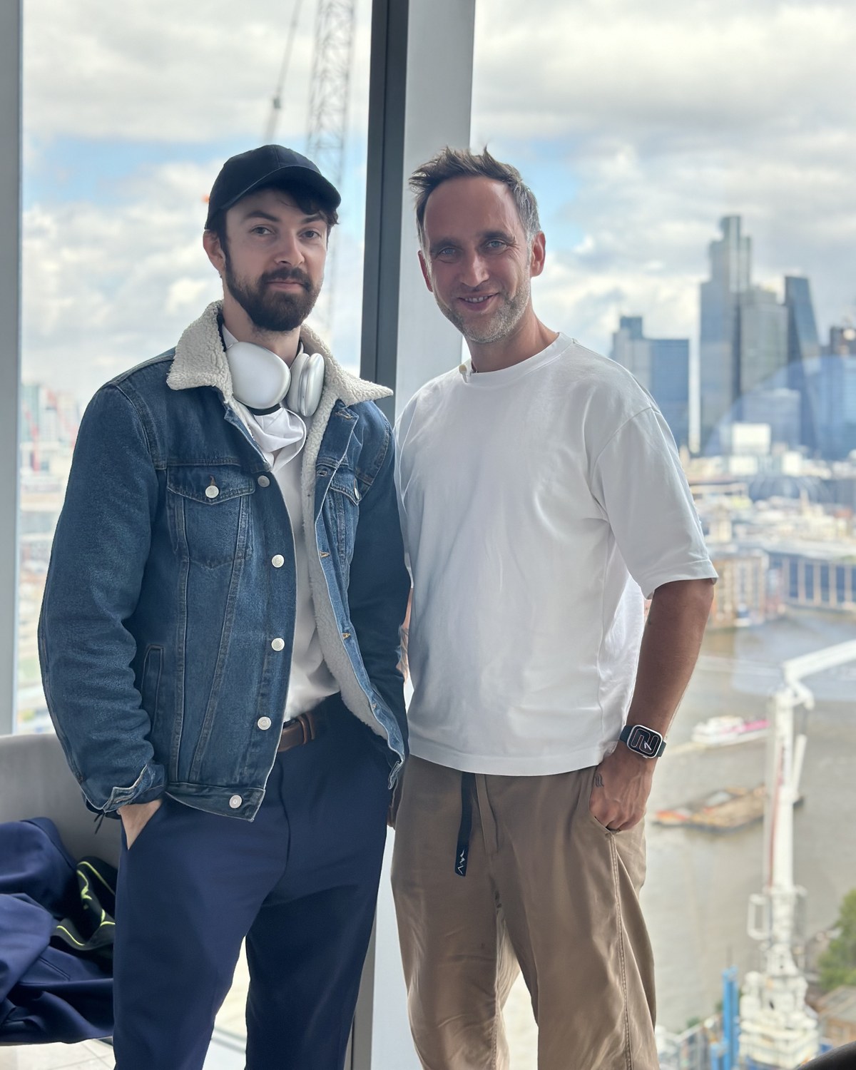 Oliver Zolman and Marek Piotrowski at the window above the Thames in London