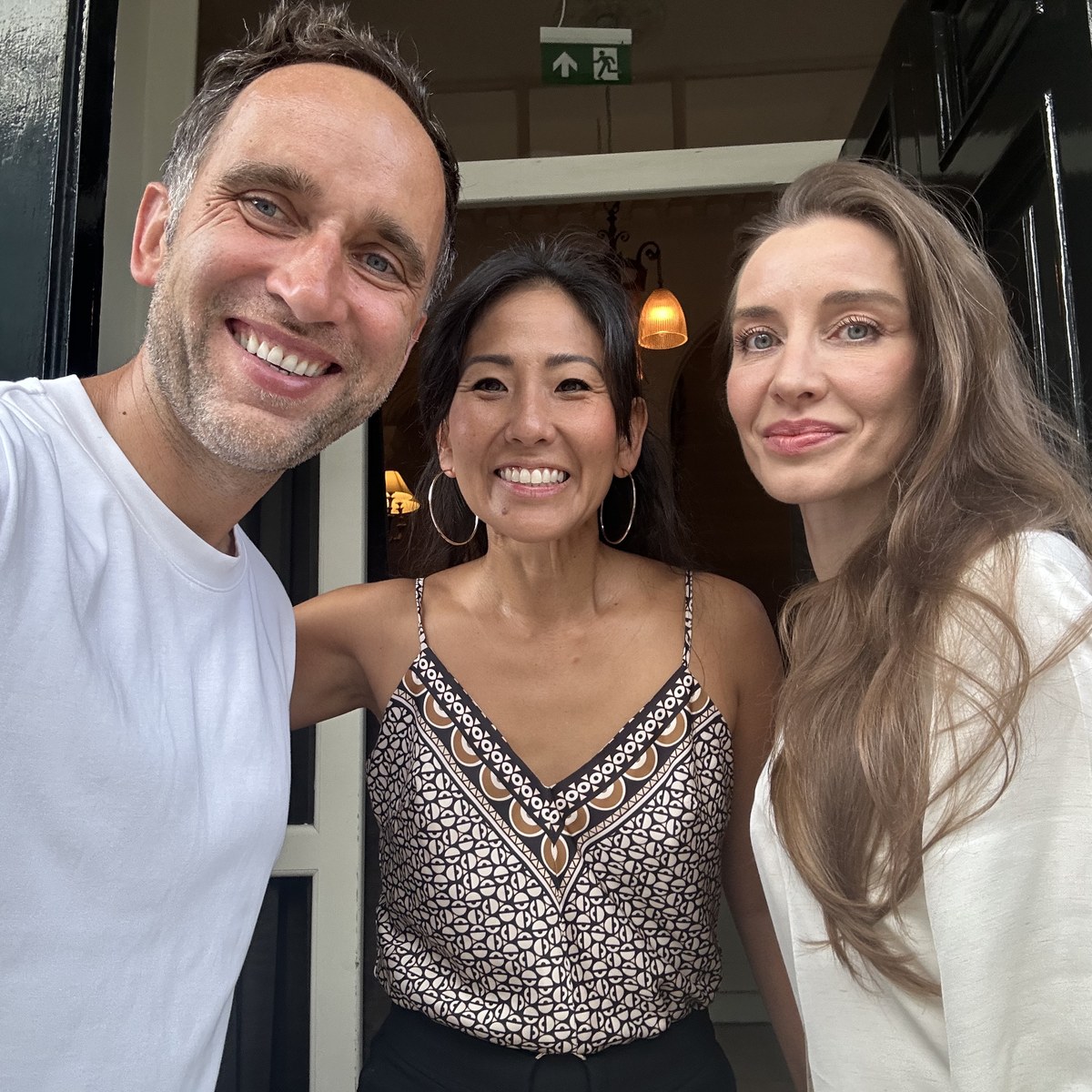 Olivia Lesslar and Kasia Zajkowska with Marek in a London doorway