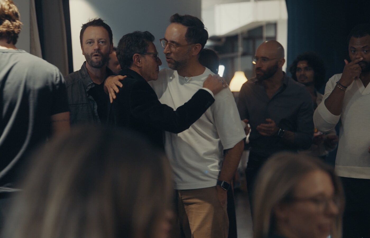 Oz Garcia greeting Marek at a gathering in New York