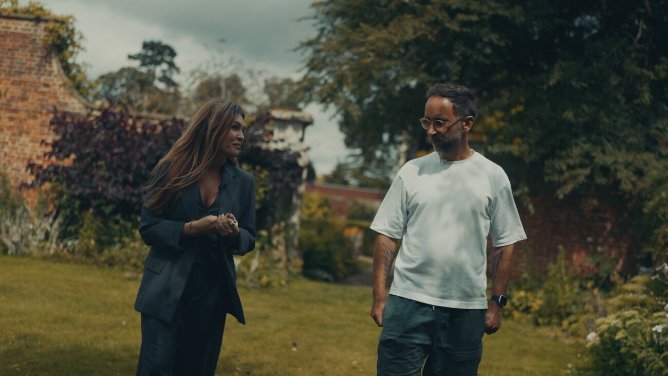 Marek and Stasa Stankovic walking in the garden at Babraham, Cambridge