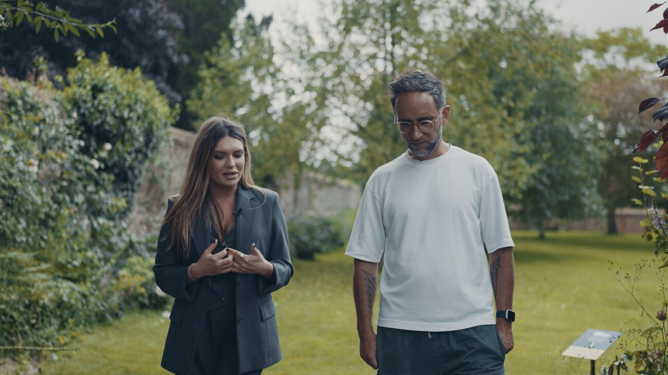 Stasa Stankovic and Marek in conversation in the garden, Cambridge