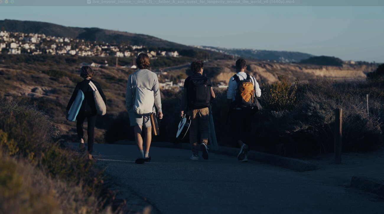 Vittorio Sebastiano&rsquo;s son with Alek and Marek walking to the beach at sunset in Irvine